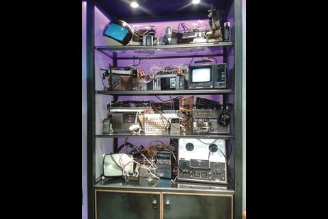 The display behind the tills features retro radios and monitors